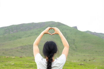 Poster - woman hand heart sign in  mountain