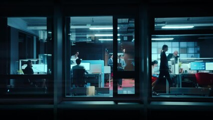 Poster - Footage from Outside the Window: Businessmen and Businesswomen Working in the Office. Managers Doing Financial Business in the Evening. Employees Work on Computers, Laptops, Mobile Phones, Tablets.