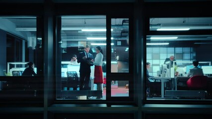 Poster - Footage from Outside: Two Business Partners Meet and Use a Tablet in Office. Managers Standing by the Window. Employees Talk about Financial and Business Development. Colleagues Work Behind Them.