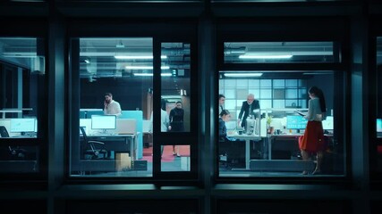 Poster - Footage from Outside the Window: Businessmen and Businesswomen Working in the Office. Managers and Specialists Doing Financial Business in the Evening. Employees Work on Computers and Delegate Tasks.