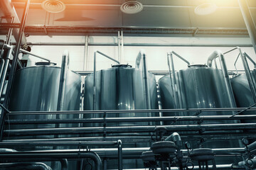 Wall Mural - Large steel industrial stainless steel vats in modern brewery, toned