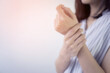 © ifriday - Close up woman suffering from pain in hand or wrist.