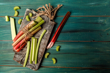 Wall Mural - fresh rhubarb on wooden table. banner menu recipe place for text. top view