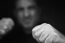 Abusive Aggressive Man Punching Fists