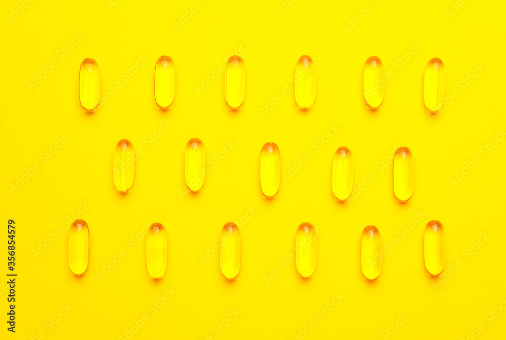 Fish oil capsules on color background