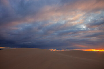 Colourful clouds over sand dunes at Myall Lakes National Park.East Coast of N.S.W. Australia.