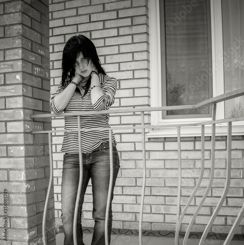 Young girl is depressed thoughts about suicide problems in her personal life, negative emotions . Problems of adolescents in social life. woman in solitude, in bad mood, sorrow and alone