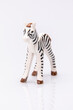 close up of a plastic stripped zebra isolated on a white background