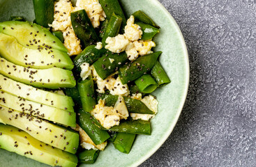 Wall Mural - Keto food with avocado, eggs and peas, closeup. Healthy food, low carbs concept.