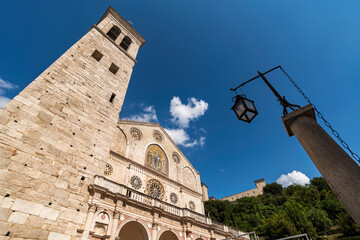 Wall Mural - spoleto, cathedral, view from below, sky background with clouds