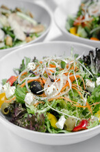 Mixed Fresh Organic Salads On White Restaurant Table