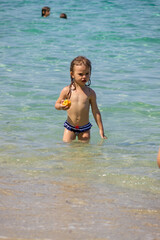 little girl eating a peach