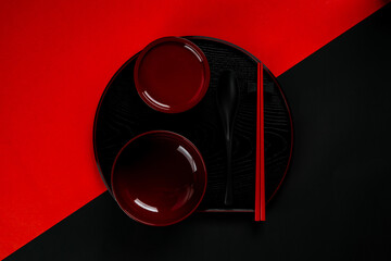 Wall Mural - Kitchenware bowl set on black and red background