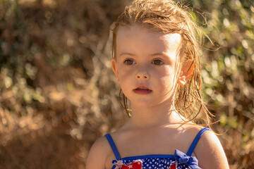 a little girl with wet hair