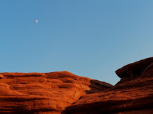 Moon Over Red Sandstone Cliff On Cavendish Beach