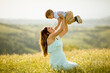 © BGStock72 - Young pregnant mother with her cute little boy in the field on beautiful sunny day