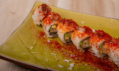 Uramaki, Japanese Sushi with octopus and avocado. Isolated image.