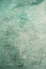 grungy stucco wall background painted with green and white