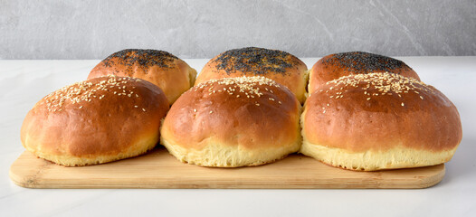 Wall Mural - hot homemade buns with sesame and poppy seeds