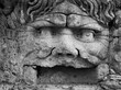 sixteenth century era statue of a man with open mouth and curly hair in the village of Bomarzo close to Rome 