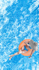 Wall Mural - Beautiful woman in hat in swimming pool aerial top view from above, young girl in bikini relaxes and swims on inflatable ring donut and has fun in water on family vacation, tropical holiday resort
