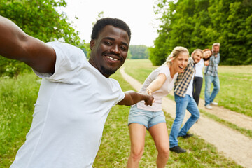 Wall Mural - Students form a human chain in the park