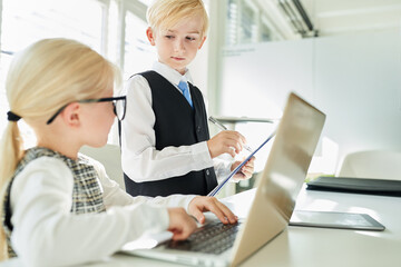 Boy and girl at the laptop computer