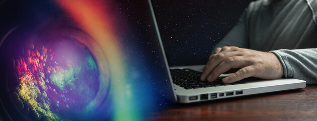 Poster - Close up Man sitting laptop on a red wooden table. Beautiful colorfull background.