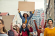 © Rido - Happy group of people holding blank banner during strike