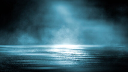 Dark dramatic abstract scene background. Neon glow reflected on the pavement. Smoke, smog and fog. Dark street, wet asphalt, reflections of rays in the water. Abstract dark blue background. 