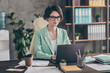 Focused girl agent lawyer manager sit desk chair work laptop have online communication colleagues boss read development company aim progress report wear blazer jacket in workplace workstation