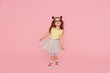 © oes - Portrait of surprised cute little toddler girl  in sunglasses over pink background.  Child model have fun and jump. Advertising childrens products