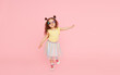 © oes - Portrait of surprised cute little toddler girl  in sunglasses over pink background.  Child model have fun and jump. Advertising childrens products
