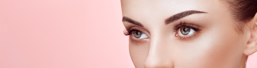 Wall Mural - beautiful woman with extreme long false eyelashes. eyelash extensions. makeup, cosmetics. beauty, sk