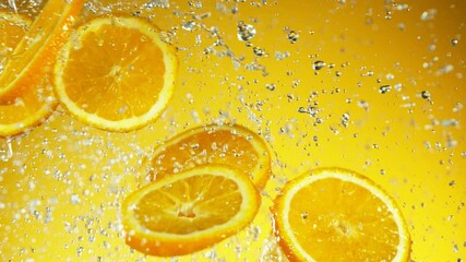 Aufkleber - Super slow motion of orange slices collision with water splashes. Filmed on high speed cinema camera, 1000 fps.