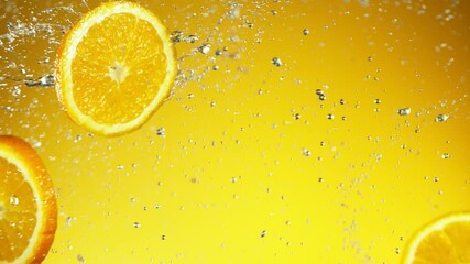 Fototapete - Super slow motion of orange slices collision with water splashes. Filmed on high speed cinema camera, 1000 fps.