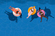 © Antonio Rodriguez - Summertime enjoyment. Gorgeous young adult women sitting on a color float inside the swimming pool. Commercial banner.