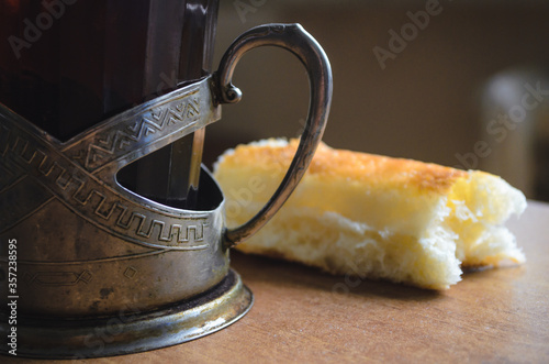 Cuadros en Lienzo A glass of tea and bread. The concept of poverty