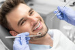 © Proxima Studio - Man having teeth examined at dentists