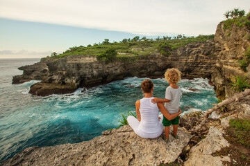 Wall Mural - Mom with son by the ocean