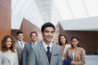 © Martin Barraud/KOTO - Portrait of confident business people in modern lobby