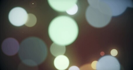 colorful defocused particles bokeh with a blurred depth of field. multi-colored bokeh moving floatin