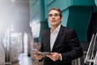 © Westend61 - Mature businessman holding tablet in a factory