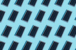 © Westend61 - Rows of portable solar panel on blue background