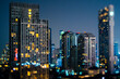 © Westend61 - Thailand, Bangkok, Tilt shift of downtown skyscrapers at night
