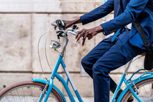 Crop View Of Businessman Riding Light Blue Vintage Bicycle