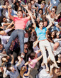 © Rob Daly/KOTO - Portrait of man and woman crowd surfing