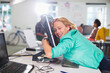 © Paul Bradbury/KOTO - Businesswoman hugging computer at desk