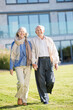 © Chris Ryan/KOTO - Older couple walking outdoors