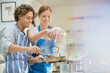 © Tom Merton/KOTO - Couple cooking in kitchen